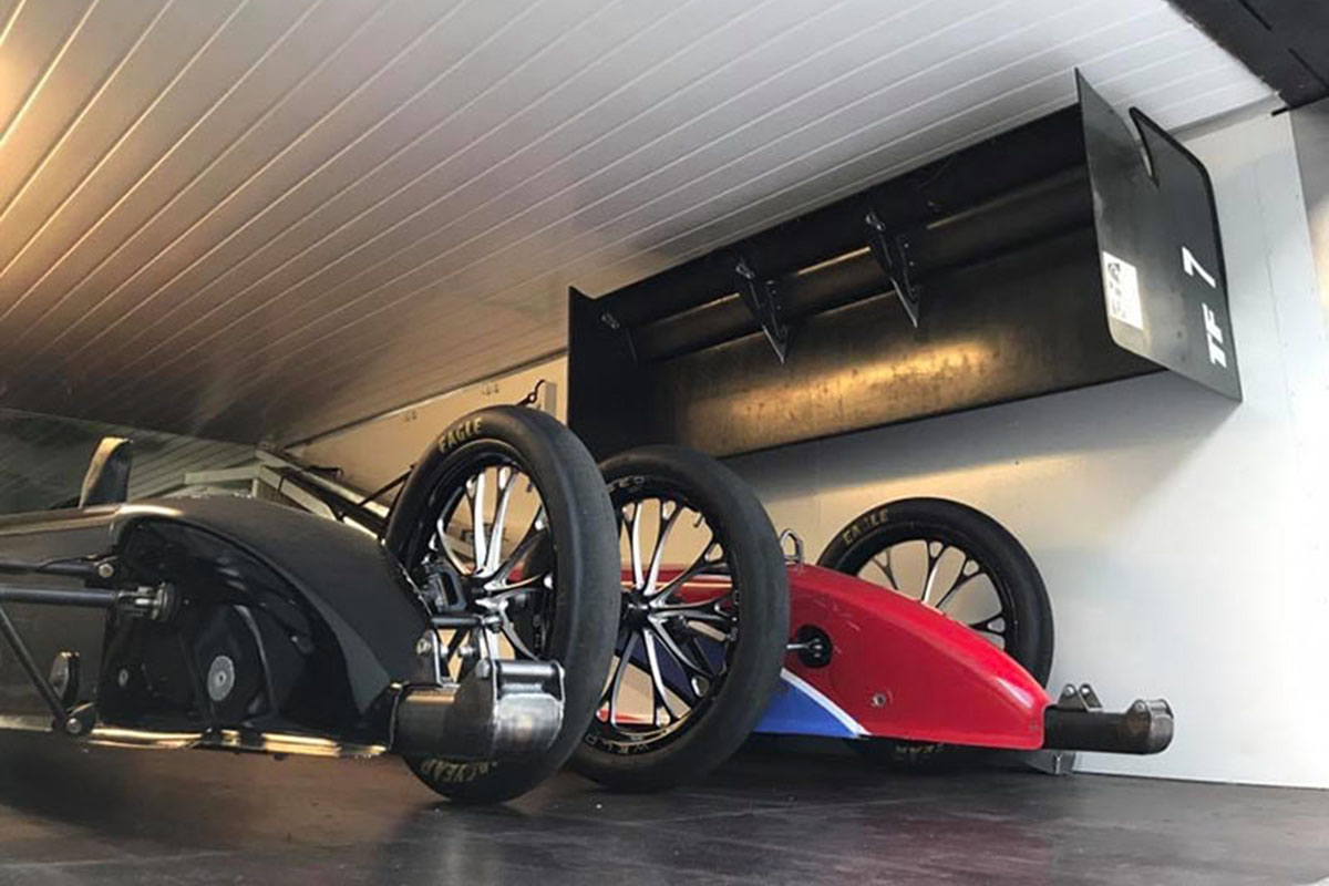 two topfuel cars loaded in the trailer